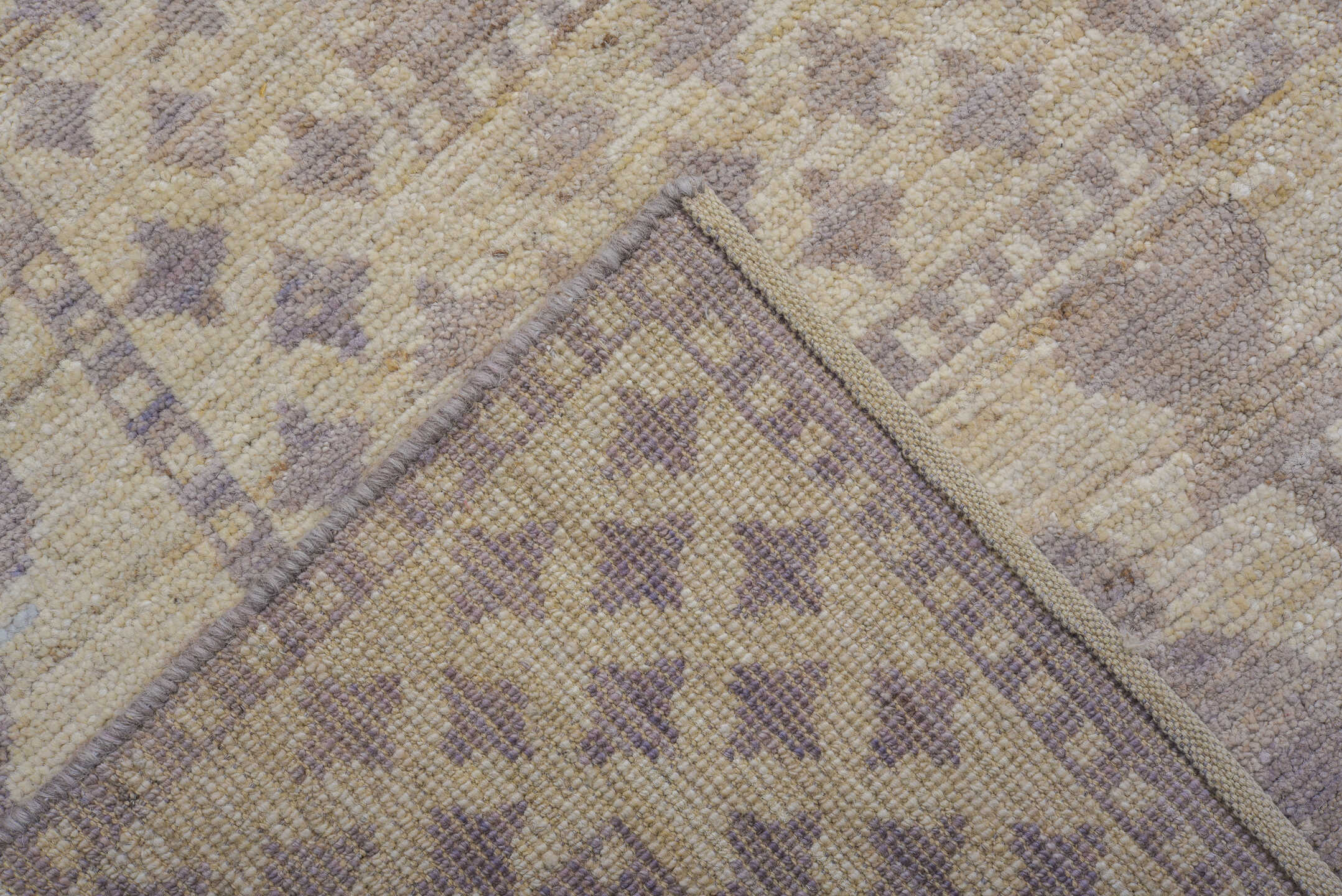 9' x 12' one-of-a-kind handmade vintage Tulu large size rug. Color palette: ivory, lavender, taupe, cream, pale gray