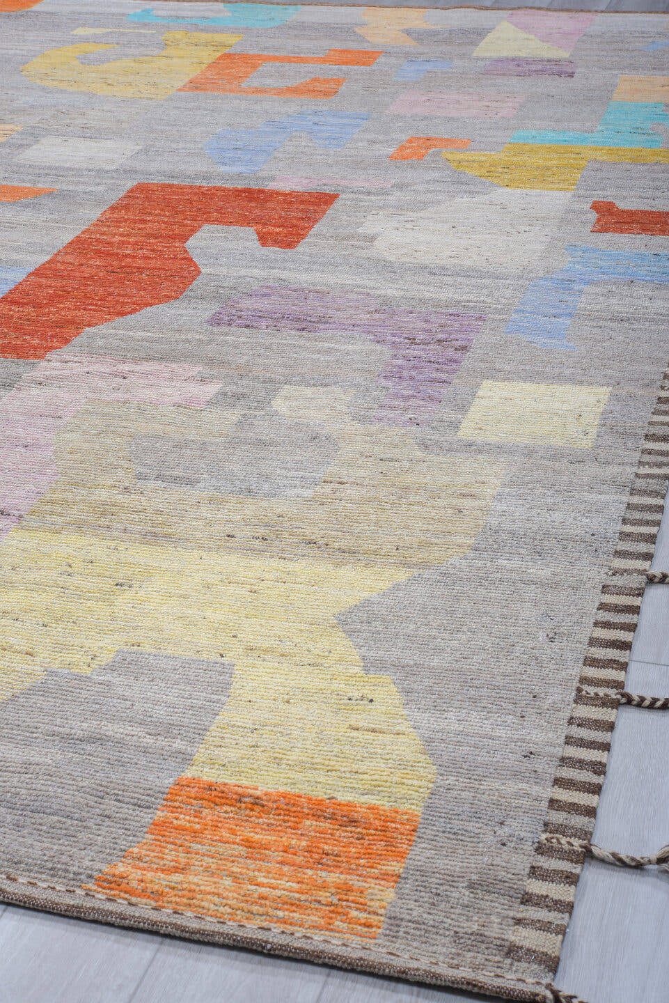 6' x 8' one-of-a-kind handmade vintage Tulu medium size rug. Color palette: gray, orange, turquoise, lavender, butter yellow