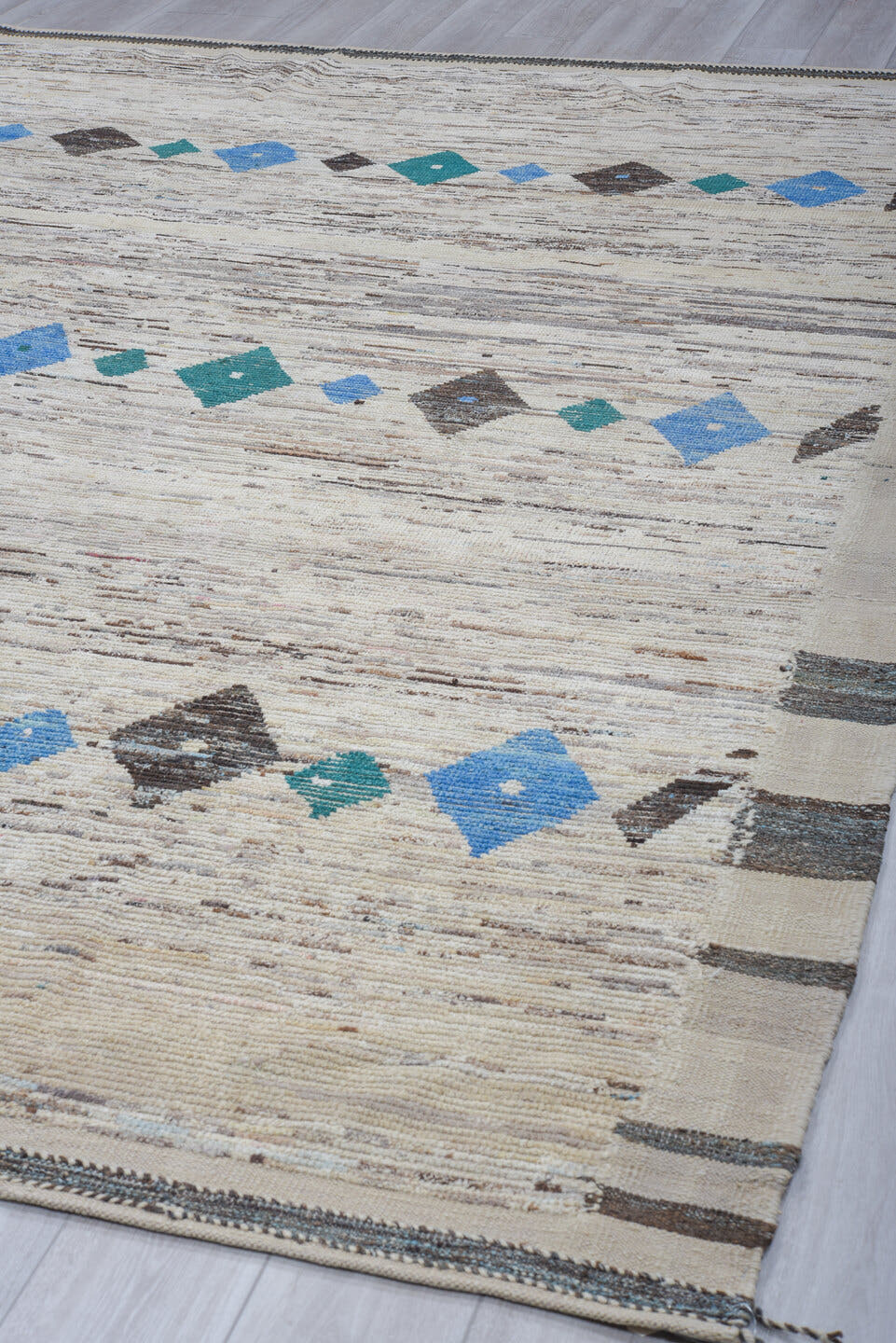 9' x 11' one-of-a-kind handmade vintage Tulu large size rug. Color palette: ivory, charcoal, sky_blue, teal, cream, gray