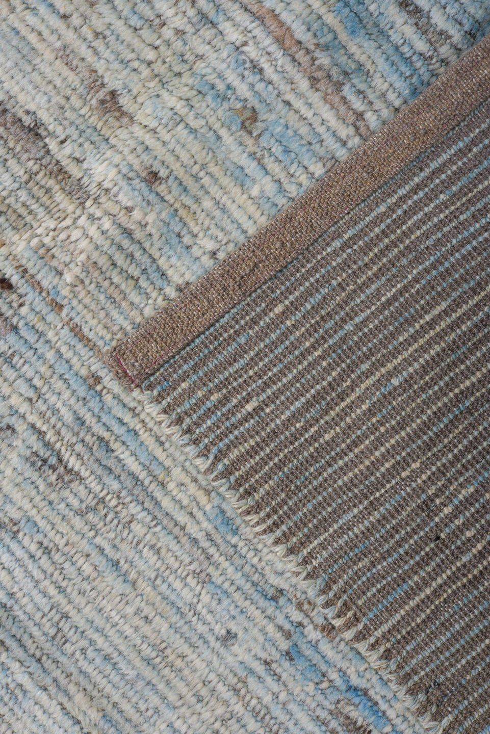 9' x 12' one-of-a-kind handmade vintage Tulu large size rug. Color palette: ivory, pale blue, sky blue, taupe, gray