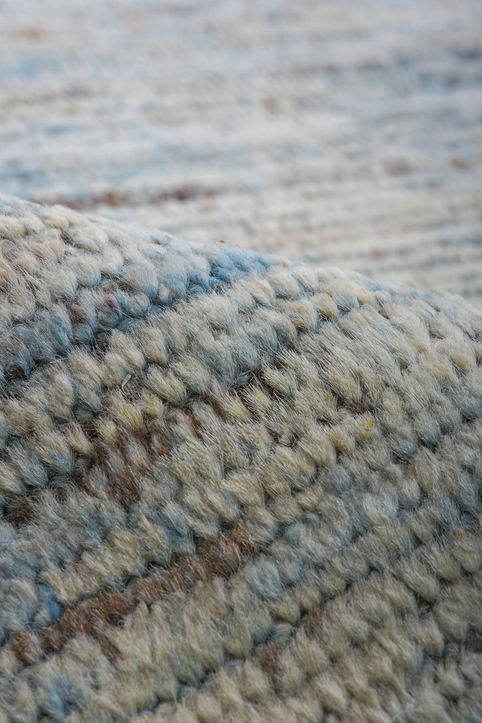9' x 12' one-of-a-kind handmade vintage Tulu large size rug. Color palette: ivory, pale blue, sky blue, taupe, gray
