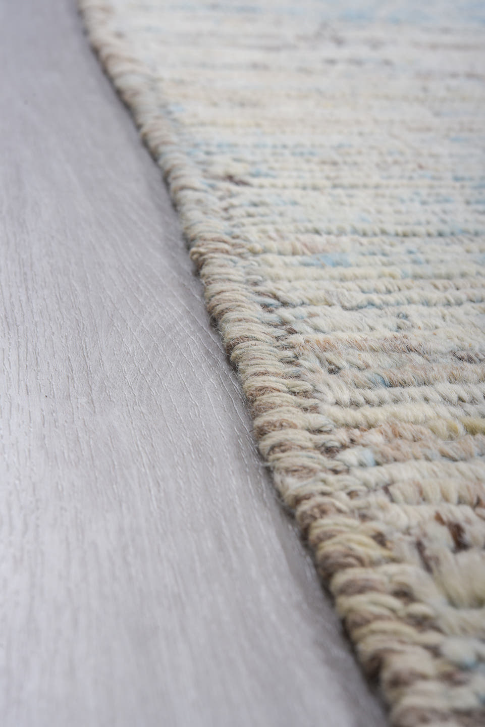 9' x 12' one-of-a-kind handmade vintage Tulu large size rug. Color palette: ivory, pale blue, sky blue, taupe, gray