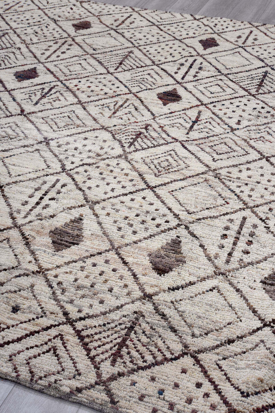 9' x 9' one-of-a-kind handmade vintage Tulu rug. Color palette: ivory, brown, taupe, charcoal, burgundy, beige, gray, black