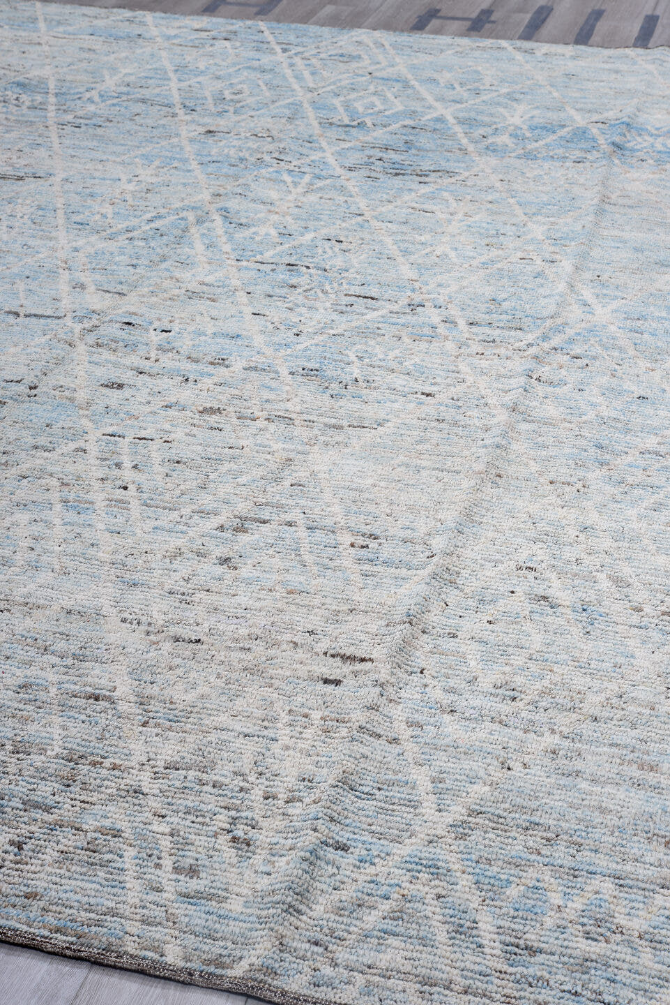 10' x 13' one-of-a-kind handmade vintage Tulu oversize rug. Color palette: ivory, pale blue, sky blue, gray, charcoal, taupe