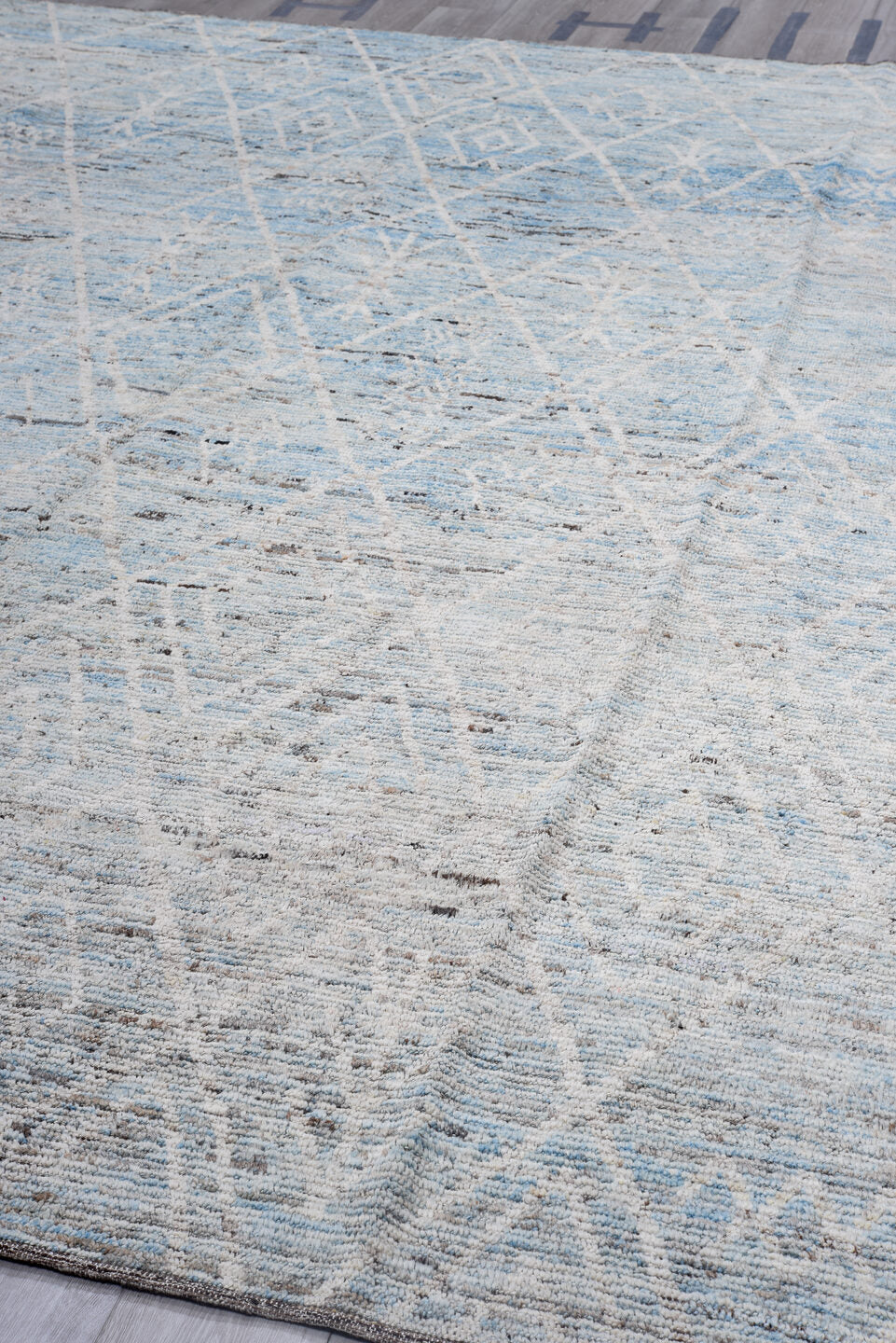 10' x 13' one-of-a-kind handmade vintage Tulu oversize rug. Color palette: ivory, pale blue, sky blue, gray, charcoal, taupe