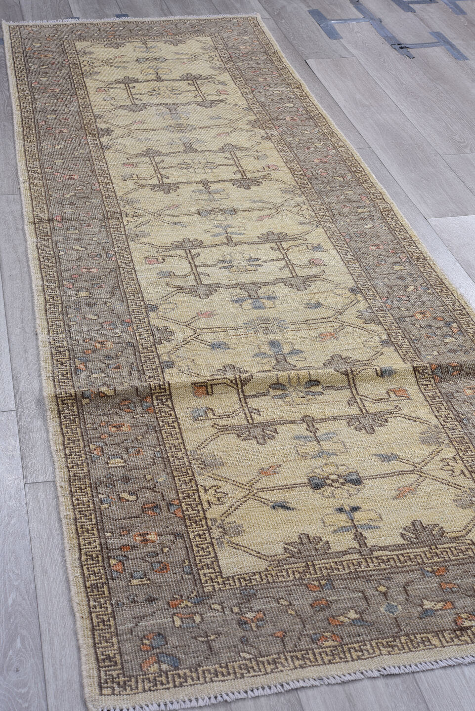 3' x 10' one-of-a-kind handmade vintage Oushak runner rug. Color palette: ivory, gray, taupe, slate, dusty blue, blush