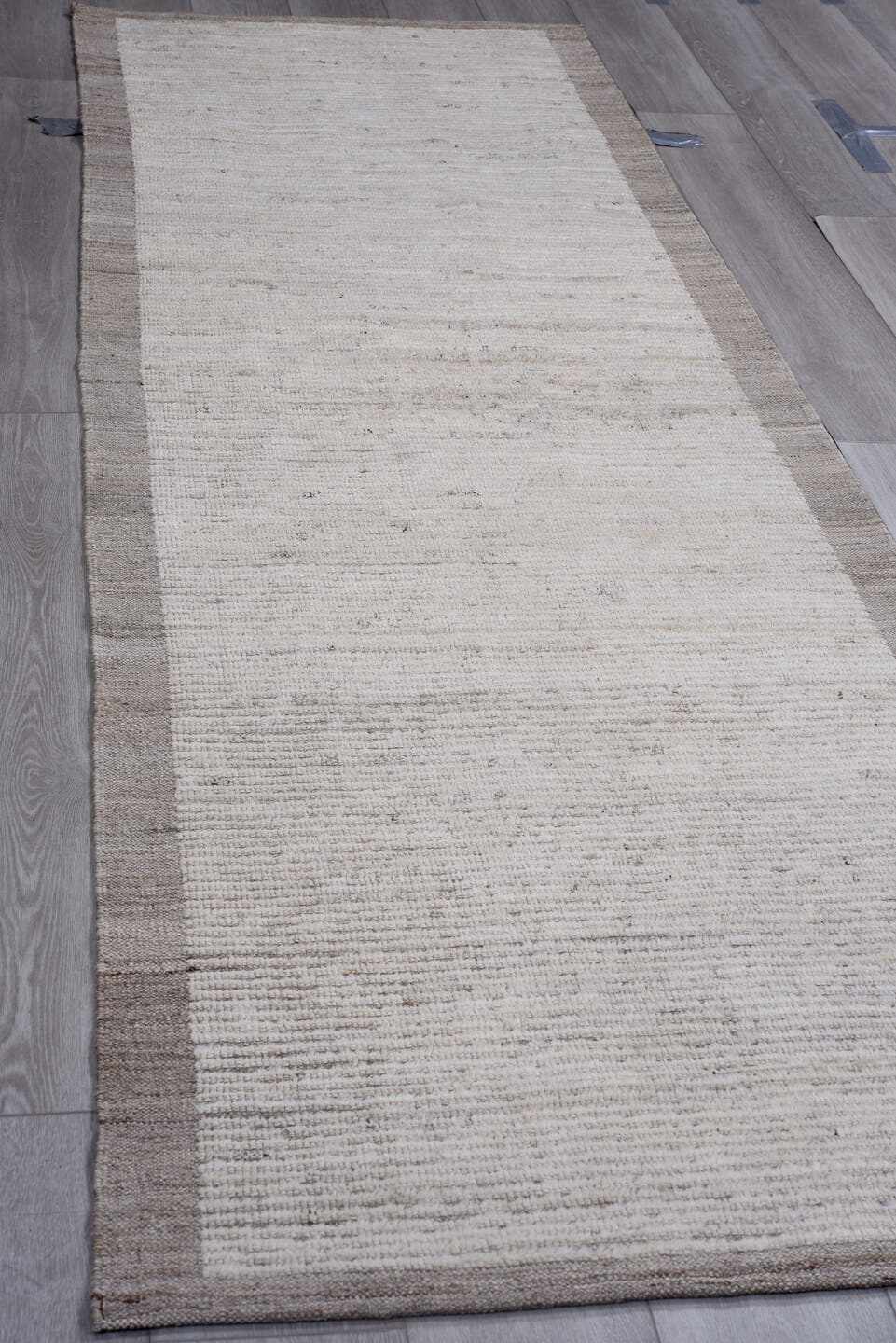 3' x 10' one-of-a-kind handmade vintage Tulu runner rug. Color palette: ivory, taupe, gray, cream, beige