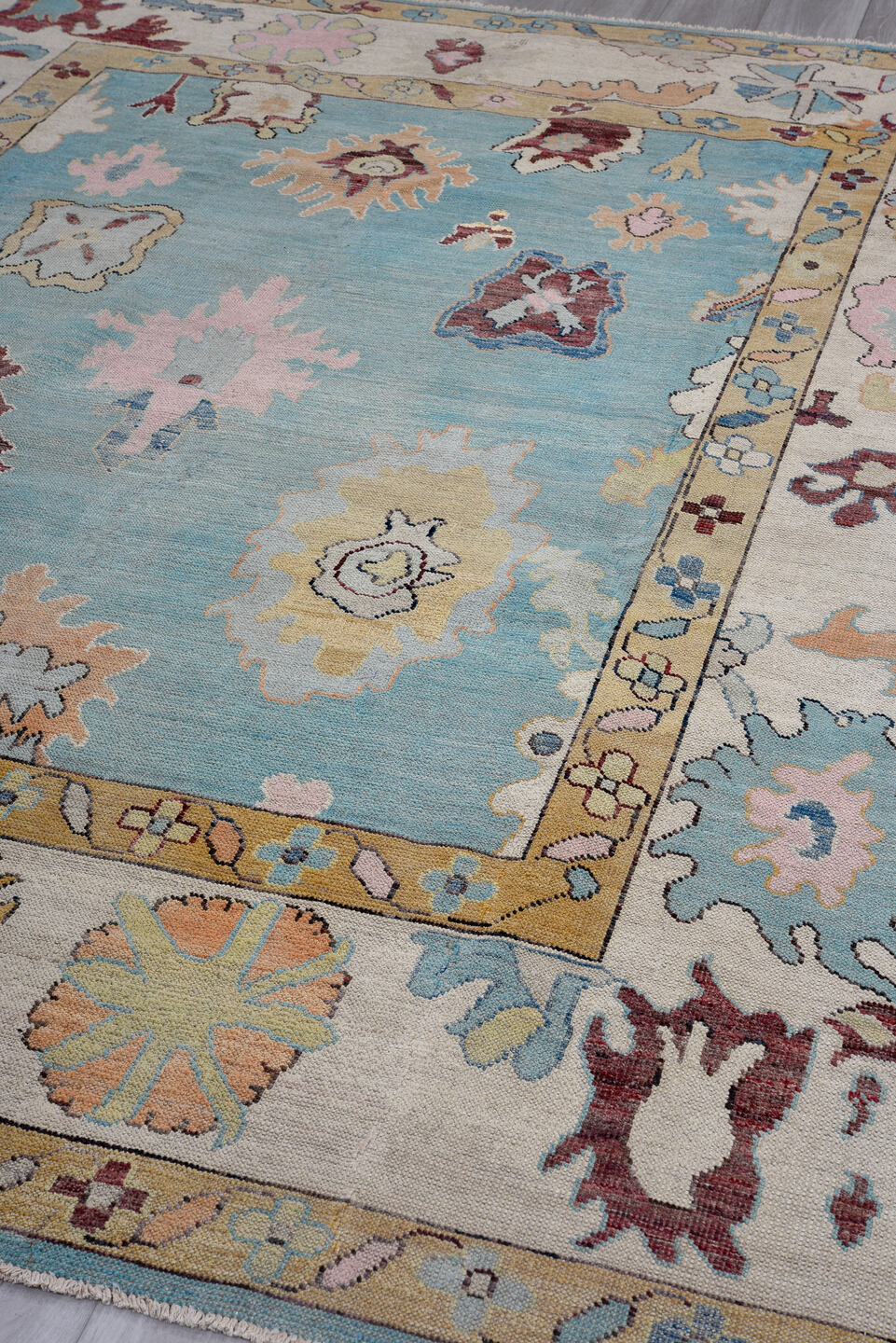 7' x 10' one-of-a-kind handmade vintage Oushak large size rug. Color palette: sky blue, ivory, gold, blush, burgundy, sage