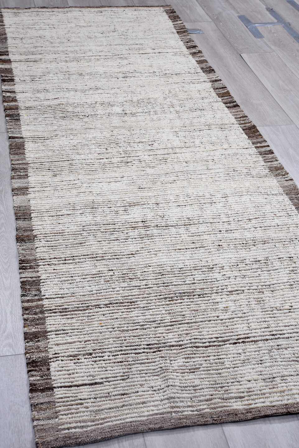 3' x 9' one-of-a-kind handmade vintage Tulu runner rug. Color palette: ivory, brown, taupe, charcoal, beige, gray, black