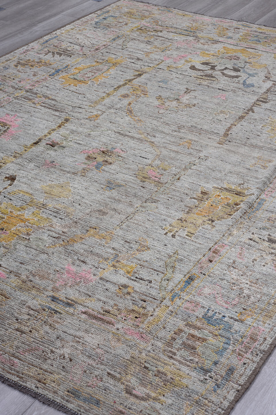 7' x 9' one-of-a-kind handmade vintage Oushak rug. Color palette: gray, taupe, gold, blush, blue, brown, ivory, beige, pink