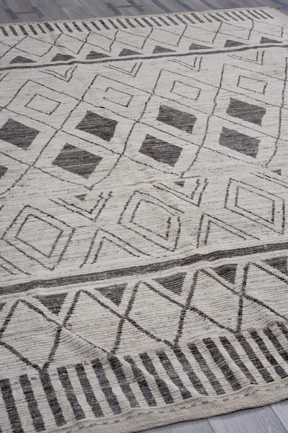 9' x 11' one-of-a-kind handmade vintage Tulu large size rug. Color palette: ivory, charcoal, taupe, gray, black, beige