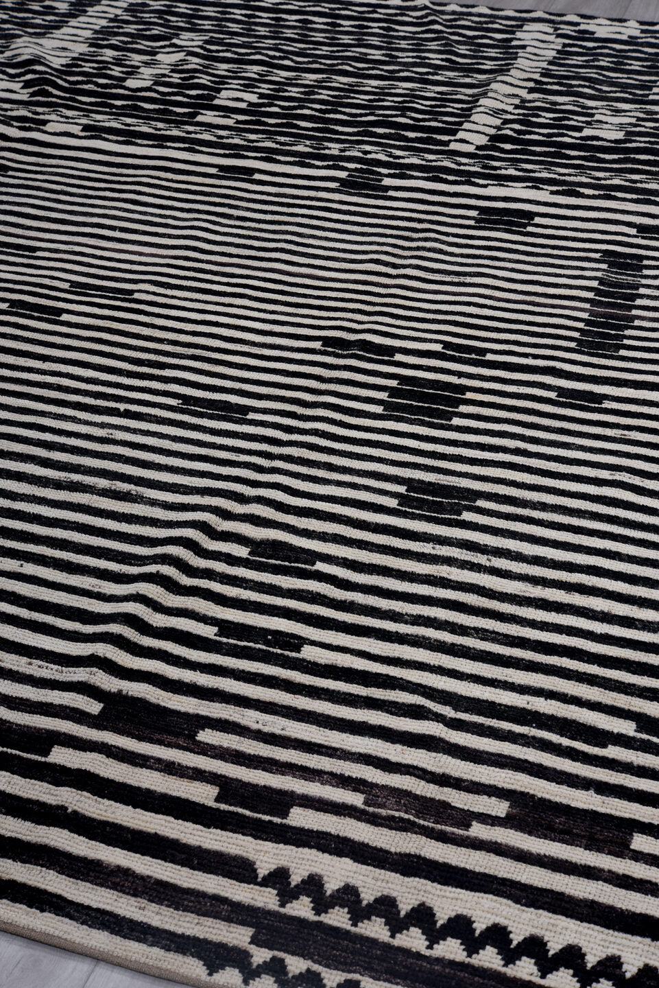 8' x 9' one-of-a-kind handmade vintage Tulu rug. Color palette: ivory, black, charcoal, gray