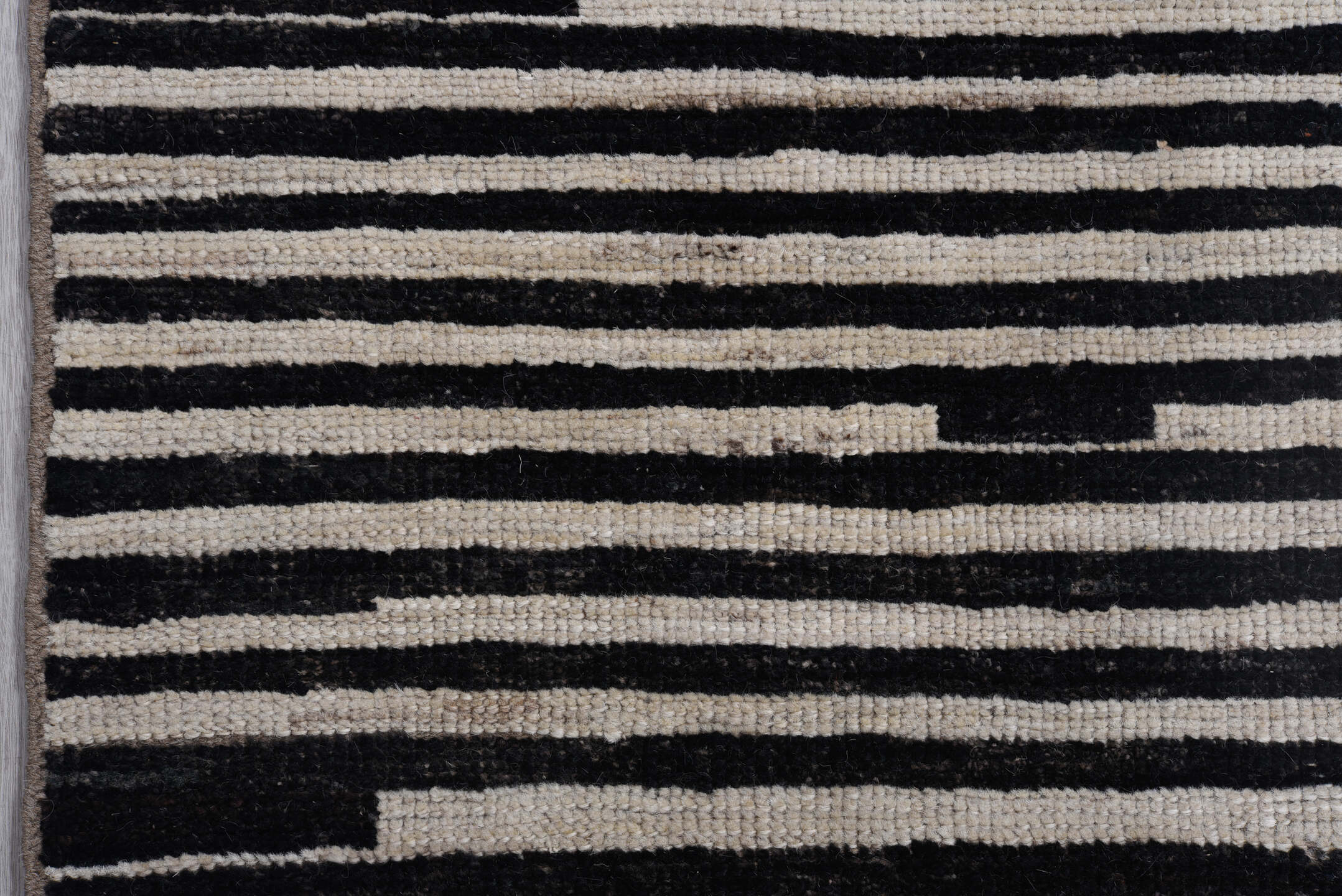 8' x 9' one-of-a-kind handmade vintage Tulu rug. Color palette: ivory, black, charcoal, gray