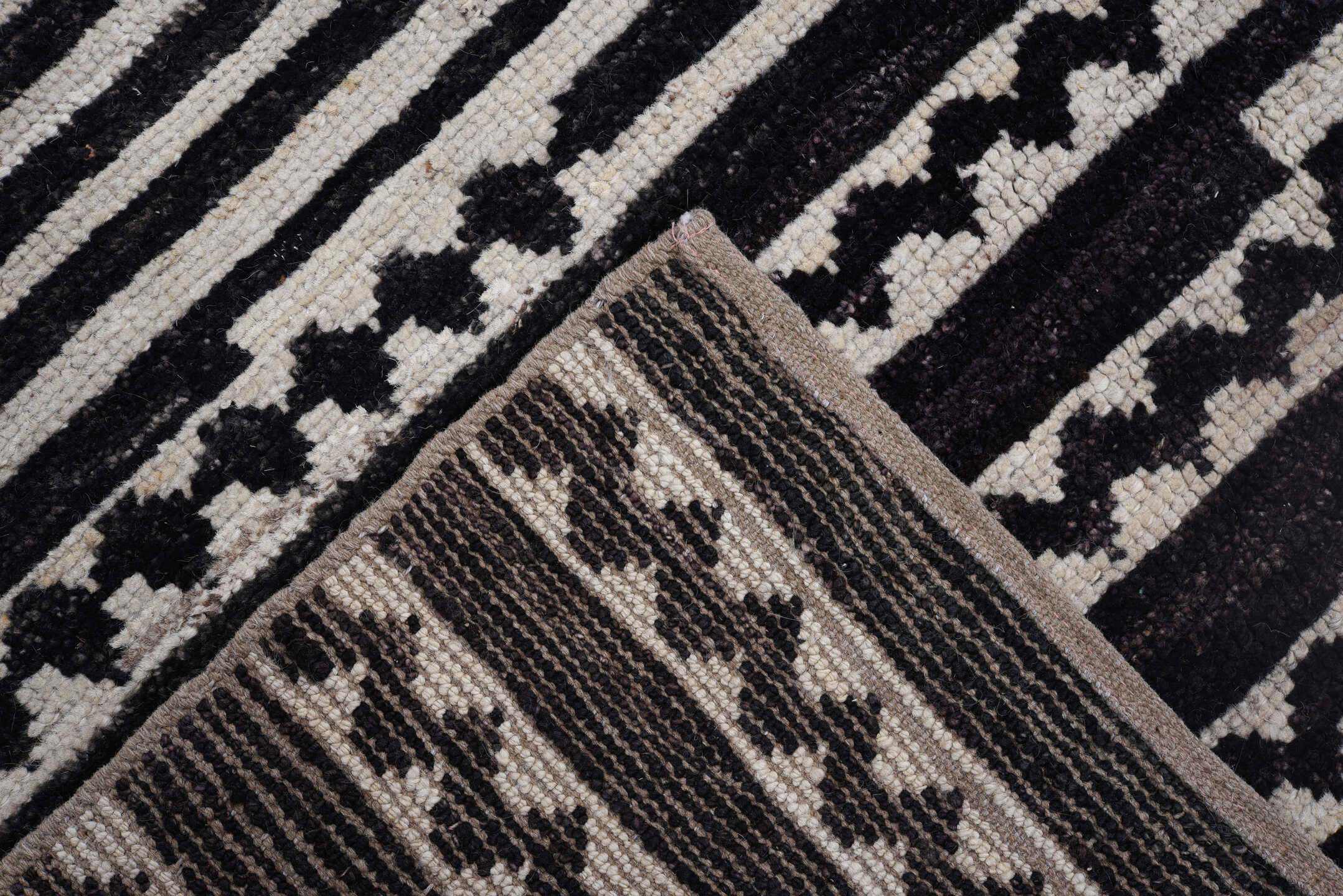 8' x 9' one-of-a-kind handmade vintage Tulu rug. Color palette: ivory, black, charcoal, gray