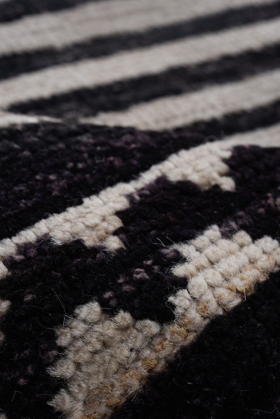 8' x 9' one-of-a-kind handmade vintage Tulu rug. Color palette: ivory, black, charcoal, gray