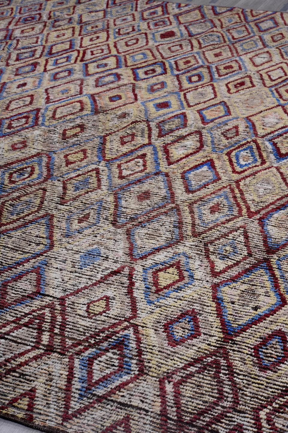 13' x 13' one-of-a-kind handmade vintage Tulu oversize rug. Color palette: ivory, red, blue, charcoal, taupe, gray, black
