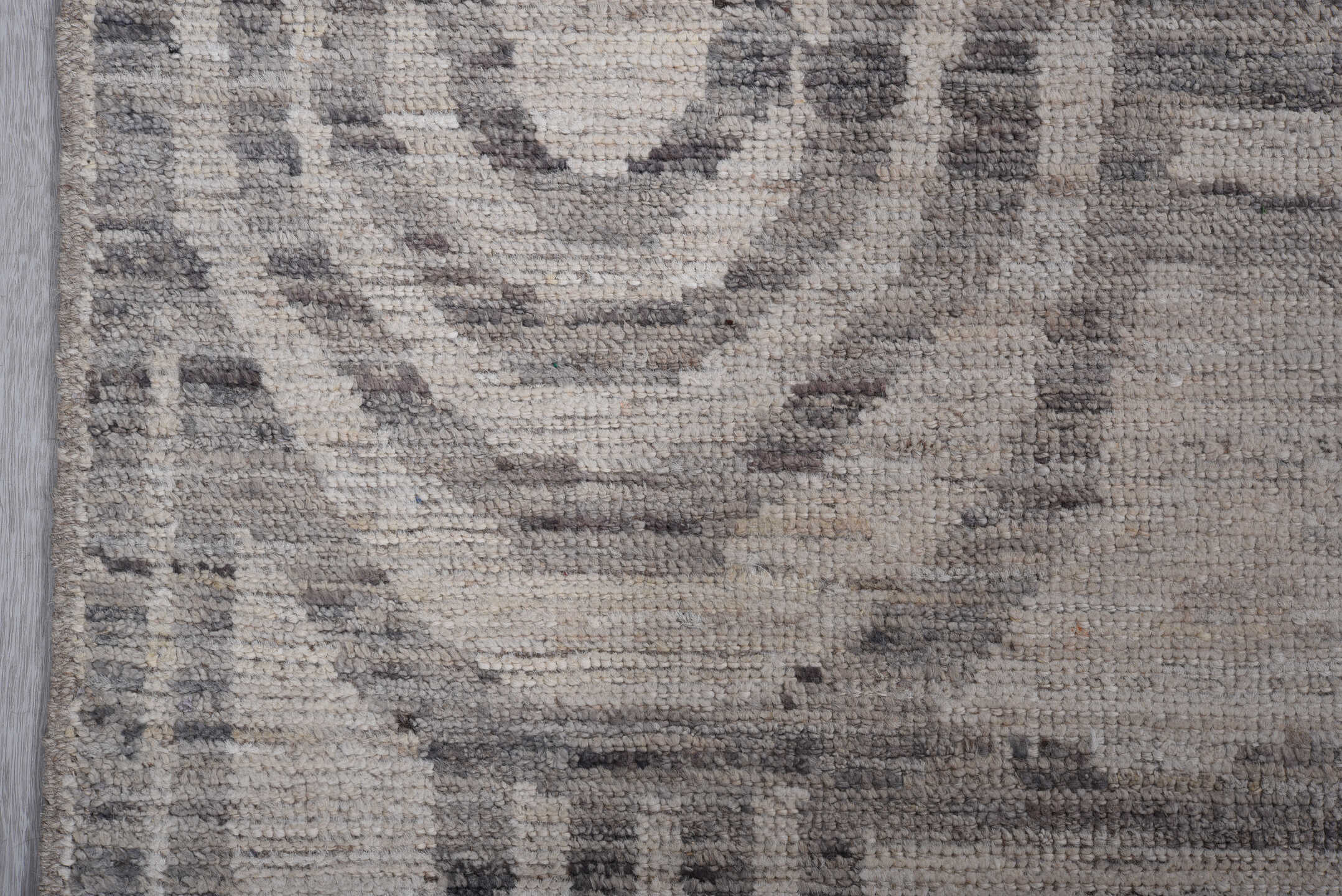 7' x 9' one-of-a-kind handmade vintage Tulu rug. Color palette: ivory, gray, charcoal, taupe, black, beige