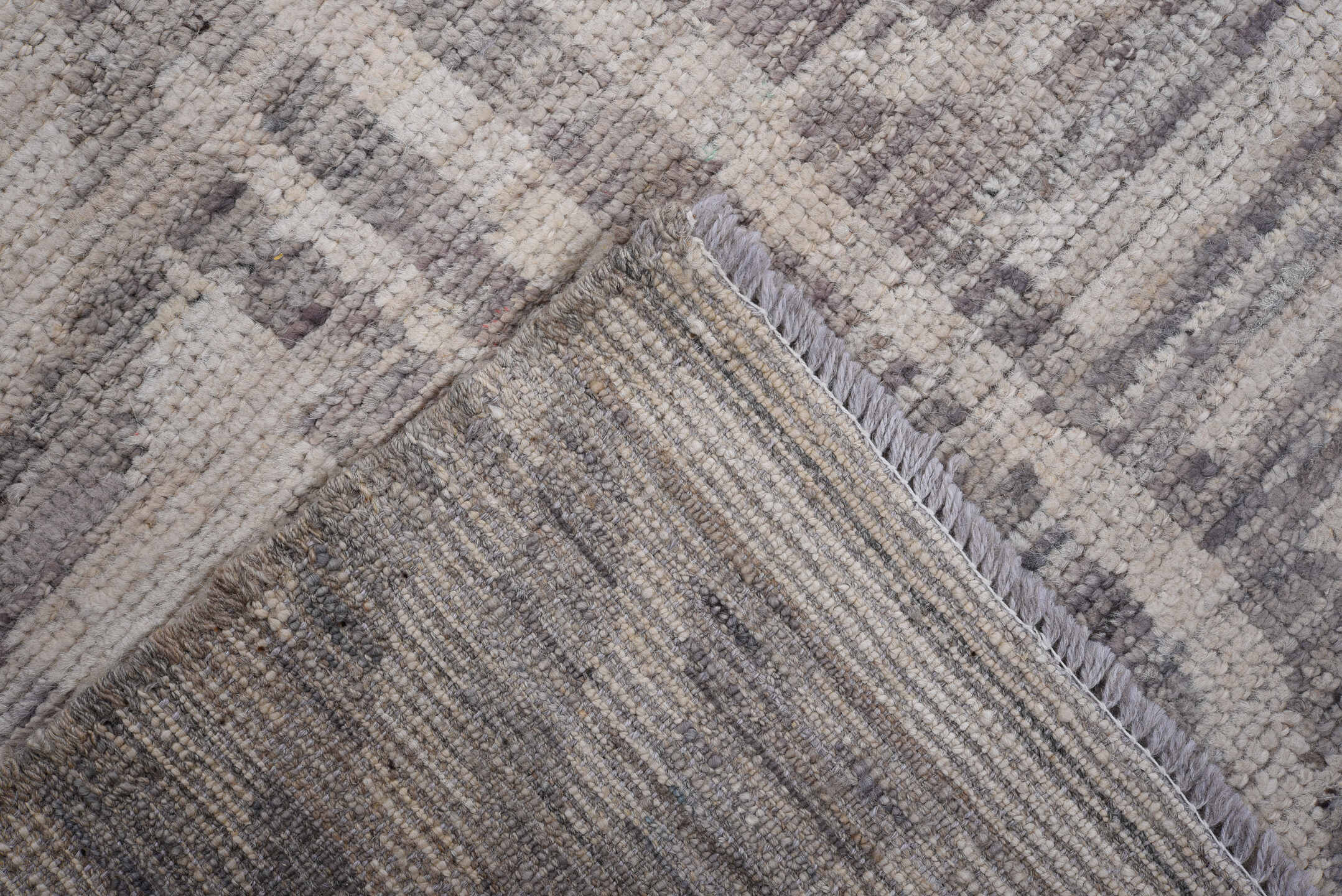 7' x 9' one-of-a-kind handmade vintage Tulu rug. Color palette: ivory, gray, charcoal, taupe, black, beige