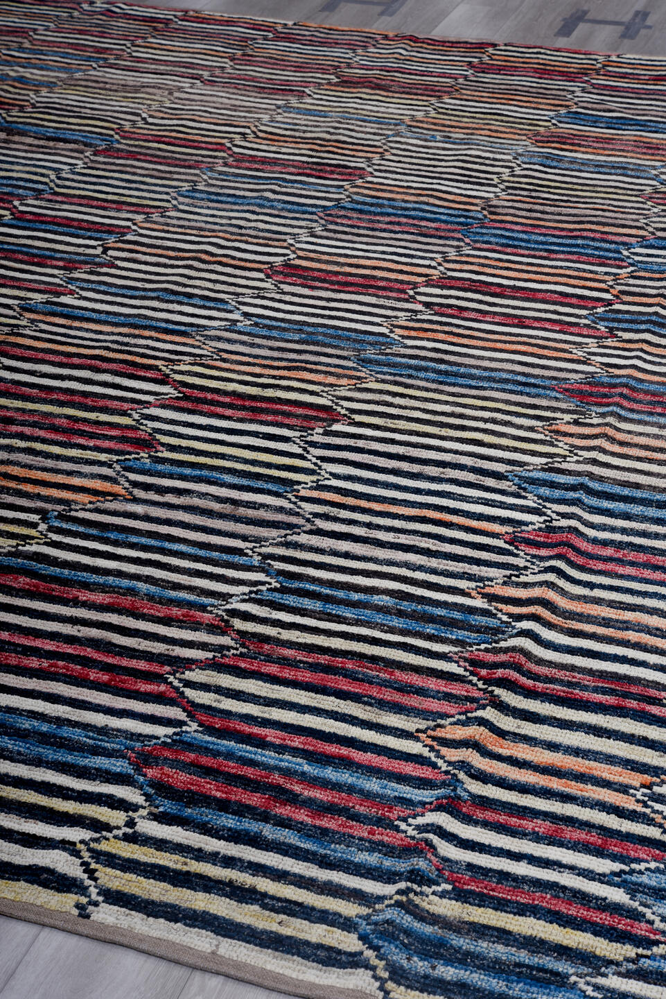 9' x 11' one-of-a-kind handmade vintage Tulu large size rug. Color palette: ivory, charcoal, indigo, crimson, rust, slate