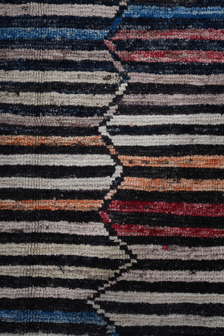 9' x 11' one-of-a-kind handmade vintage Tulu large size rug. Color palette: ivory, charcoal, indigo, crimson, rust, slate