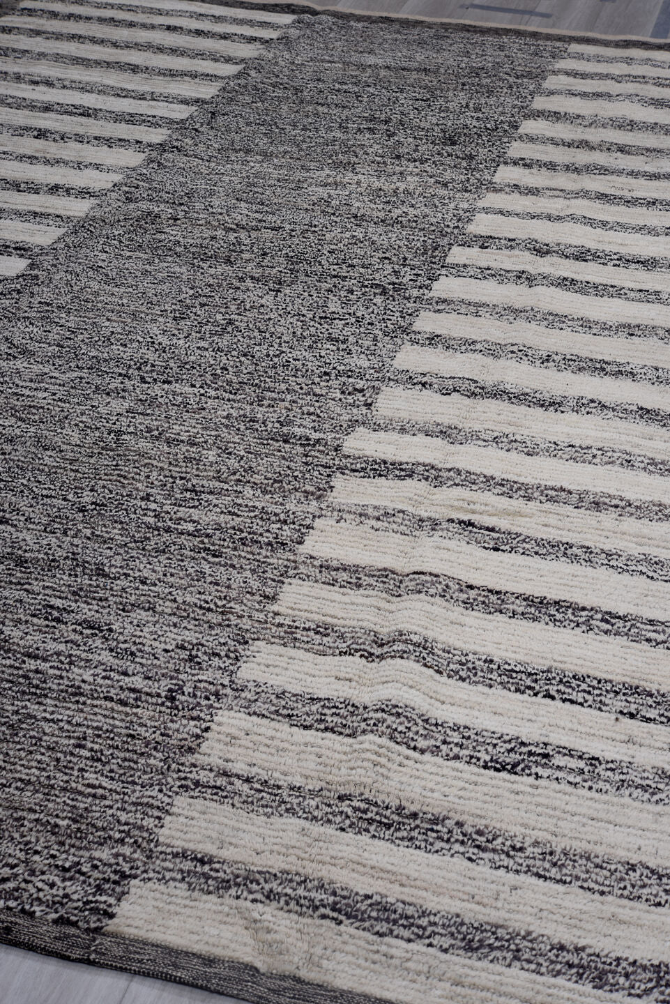 7' x 11' one-of-a-kind handmade vintage Tulu large size rug. Color palette: charcoal, ivory, gray, black