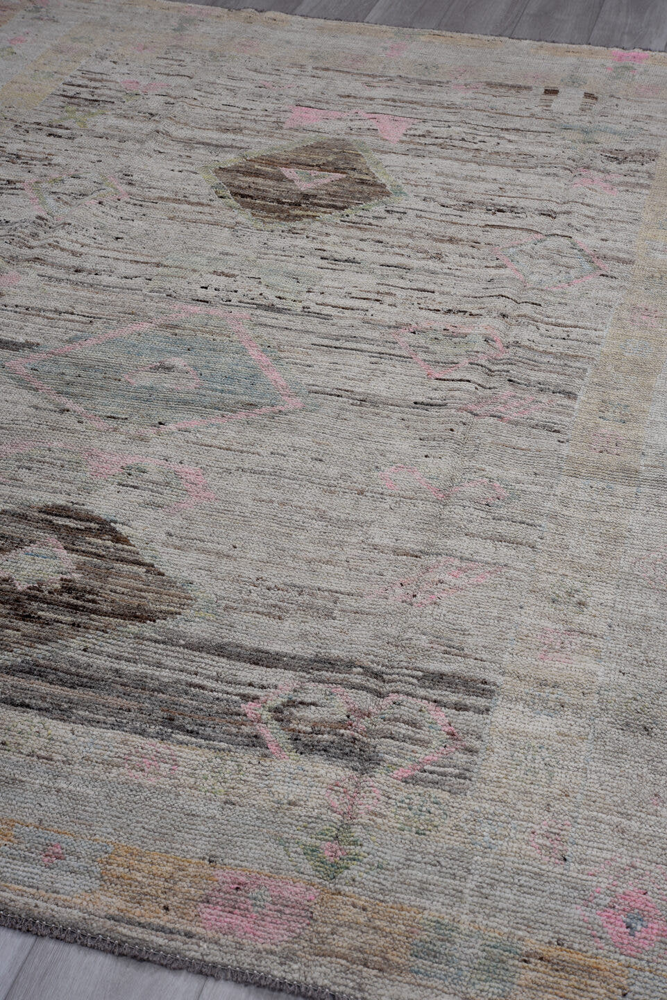 7' x 9' one-of-a-kind handmade vintage Tulu rug. Color palette: ivory, taupe, brown, blush, sage, camel, gray, beige, pink