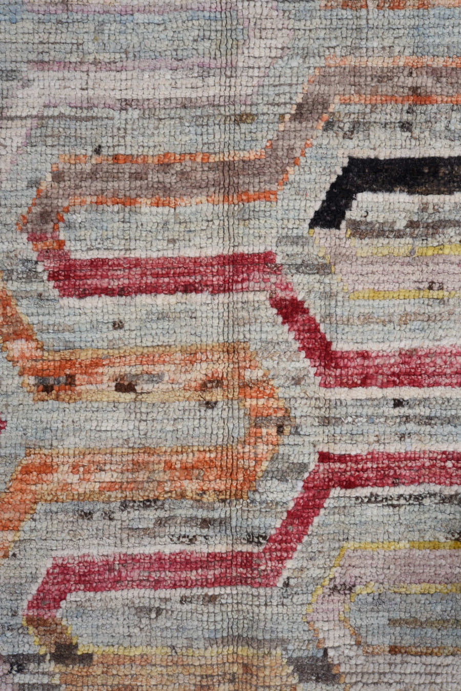 7' x 9' one-of-a-kind handmade vintage Tulu rug. Color palette: ivory, gray, rust, red, yellow, blue, charcoal, peach