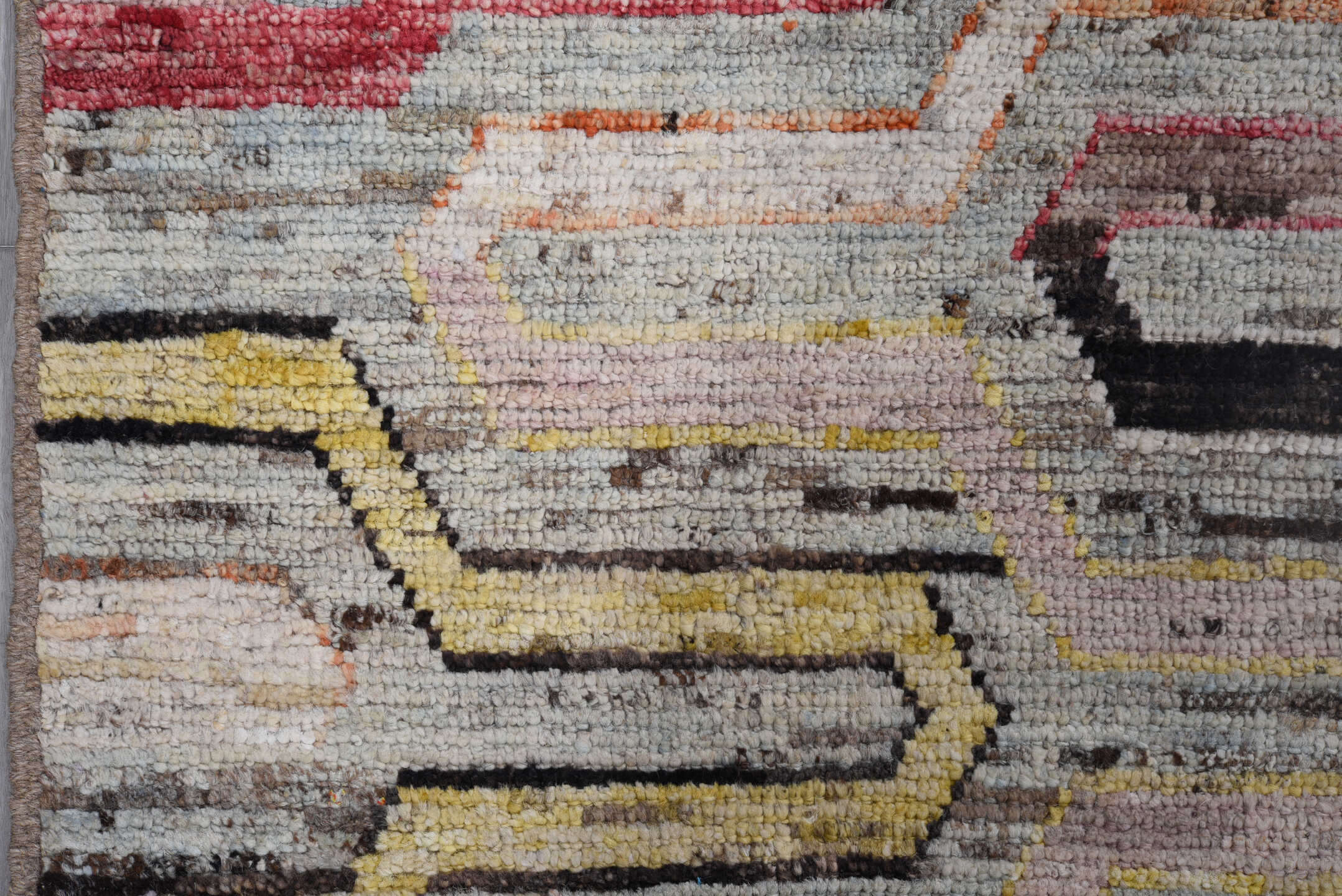 7' x 9' one-of-a-kind handmade vintage Tulu rug. Color palette: ivory, gray, rust, red, yellow, blue, charcoal, peach