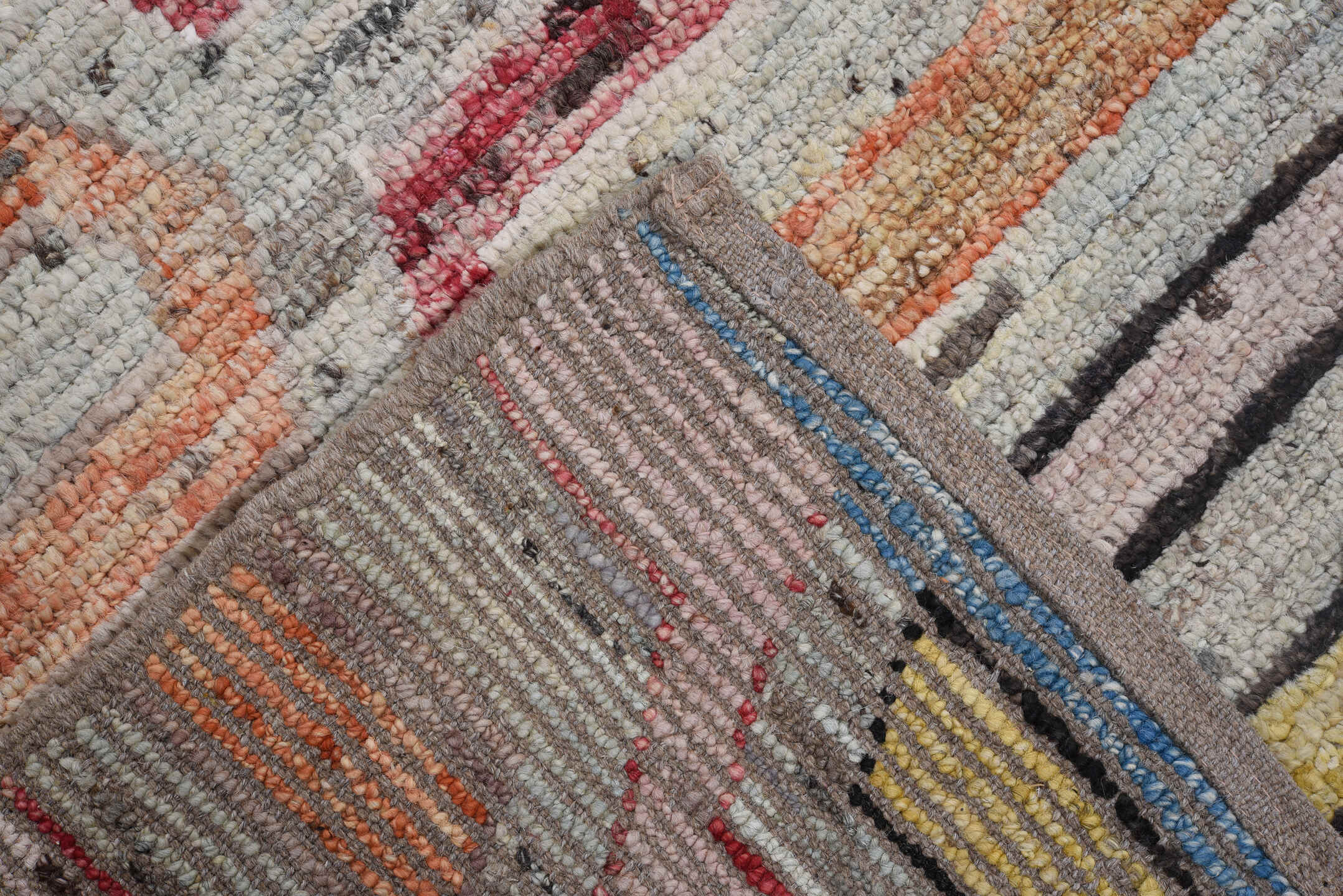 7' x 9' one-of-a-kind handmade vintage Tulu rug. Color palette: ivory, gray, rust, red, yellow, blue, charcoal, peach