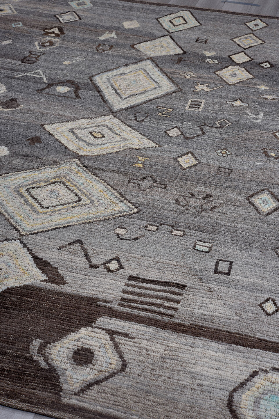 9' x 11' one-of-a-kind handmade vintage Tulu large size rug. Color palette: gray, charcoal, ivory, taupe, brown, pale blue