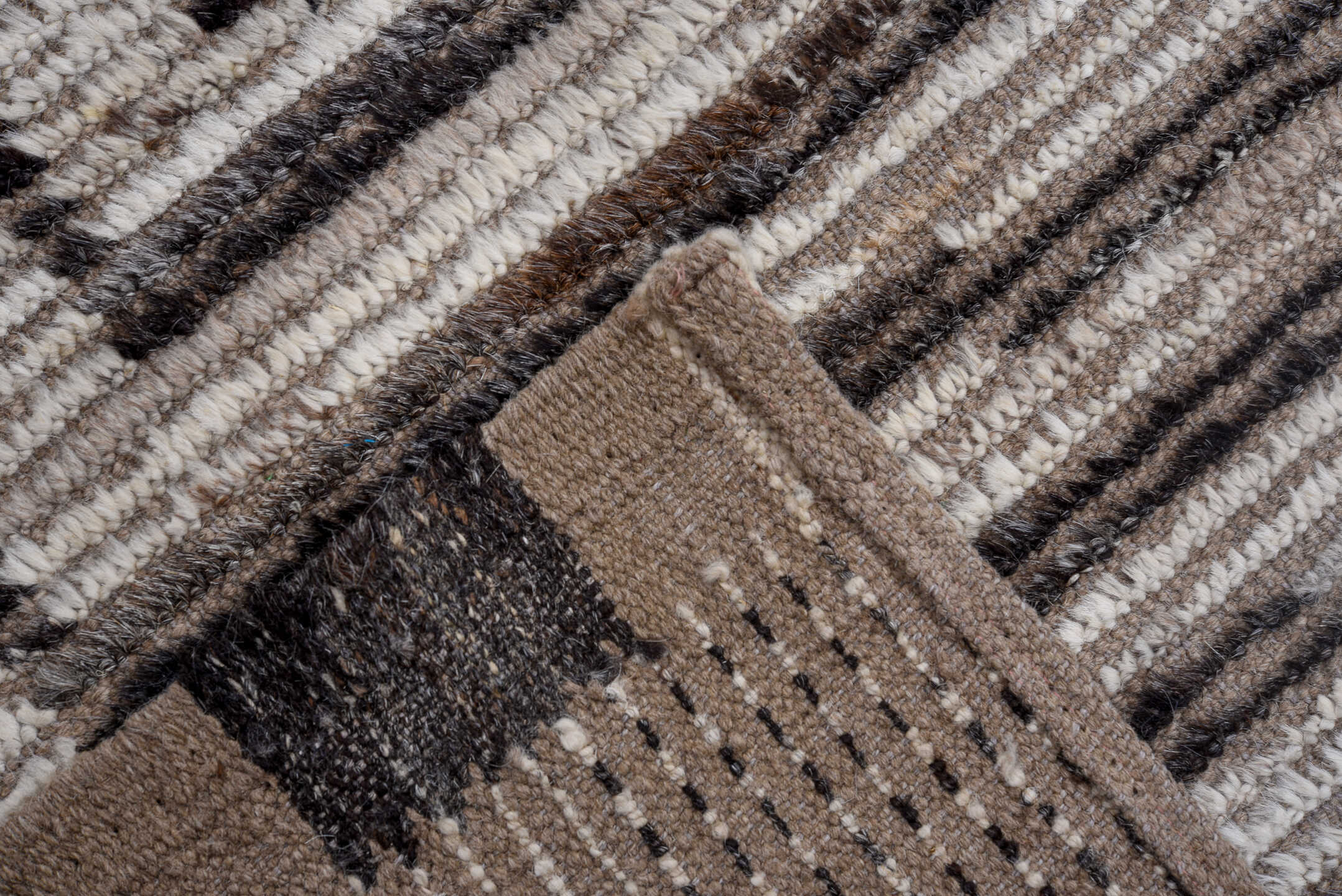 9' x 11' one-of-a-kind handmade vintage Tulu large size rug. Color palette: ivory, taupe, charcoal, brown, cream, black