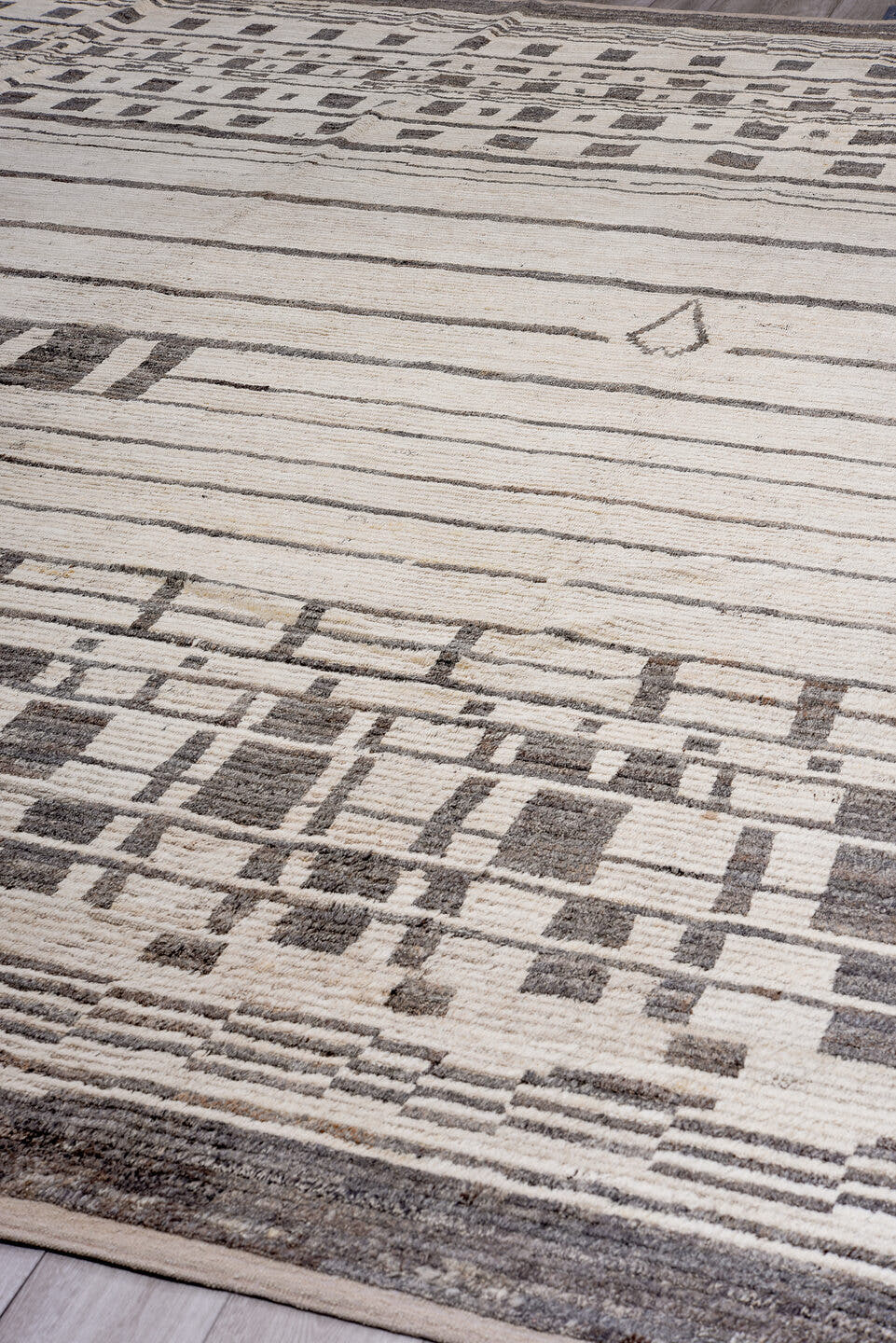 14' x 17' one-of-a-kind handmade vintage Tulu oversize rug. Color palette: ivory, charcoal, taupe, gray, black, beige