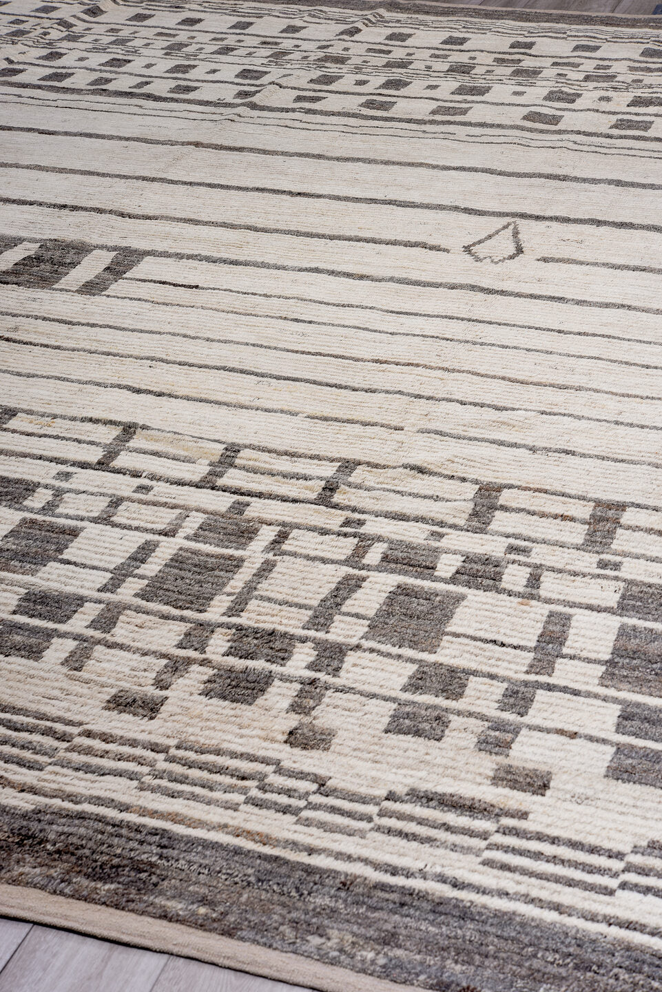 14' x 17' one-of-a-kind handmade vintage Tulu oversize rug. Color palette: ivory, charcoal, taupe, gray, black, beige