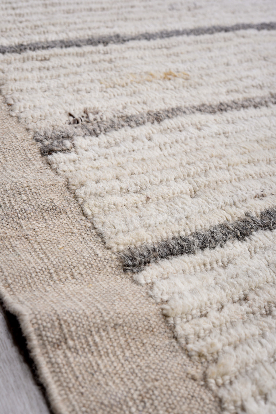 14' x 17' one-of-a-kind handmade vintage Tulu oversize rug. Color palette: ivory, charcoal, taupe, gray, black, beige