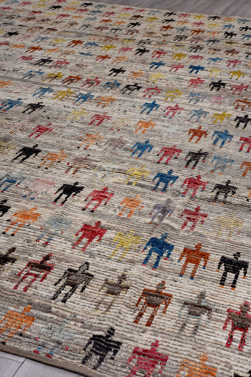 13' x 16' one-of-a-kind handmade vintage Tulu oversize rug. Color palette: ivory, gray, pink, charcoal, sky blue, gold
