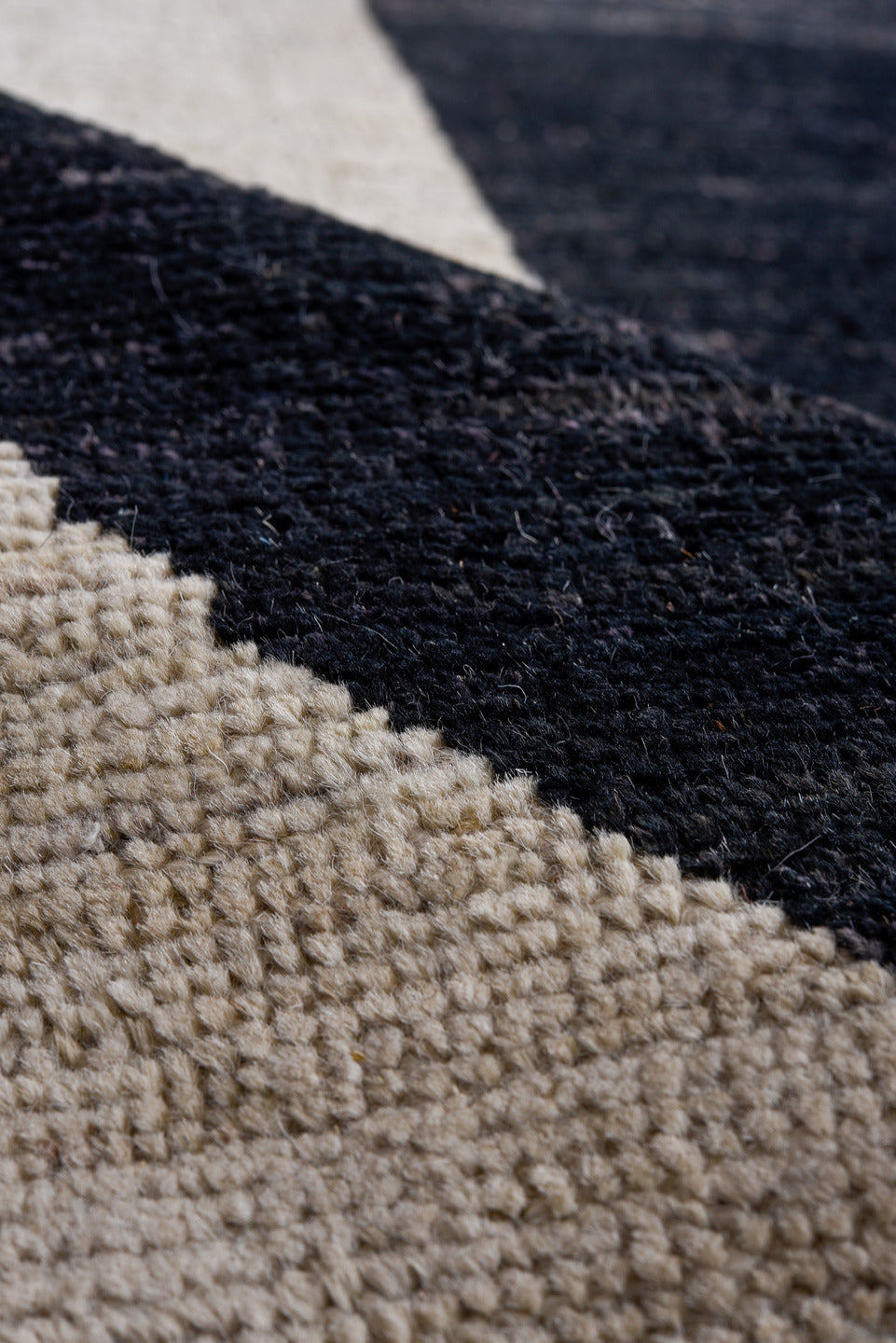 10' x 14' one-of-a-kind handmade vintage Tulu rug. Color palette: ivory, charcoal, black, slate, gray