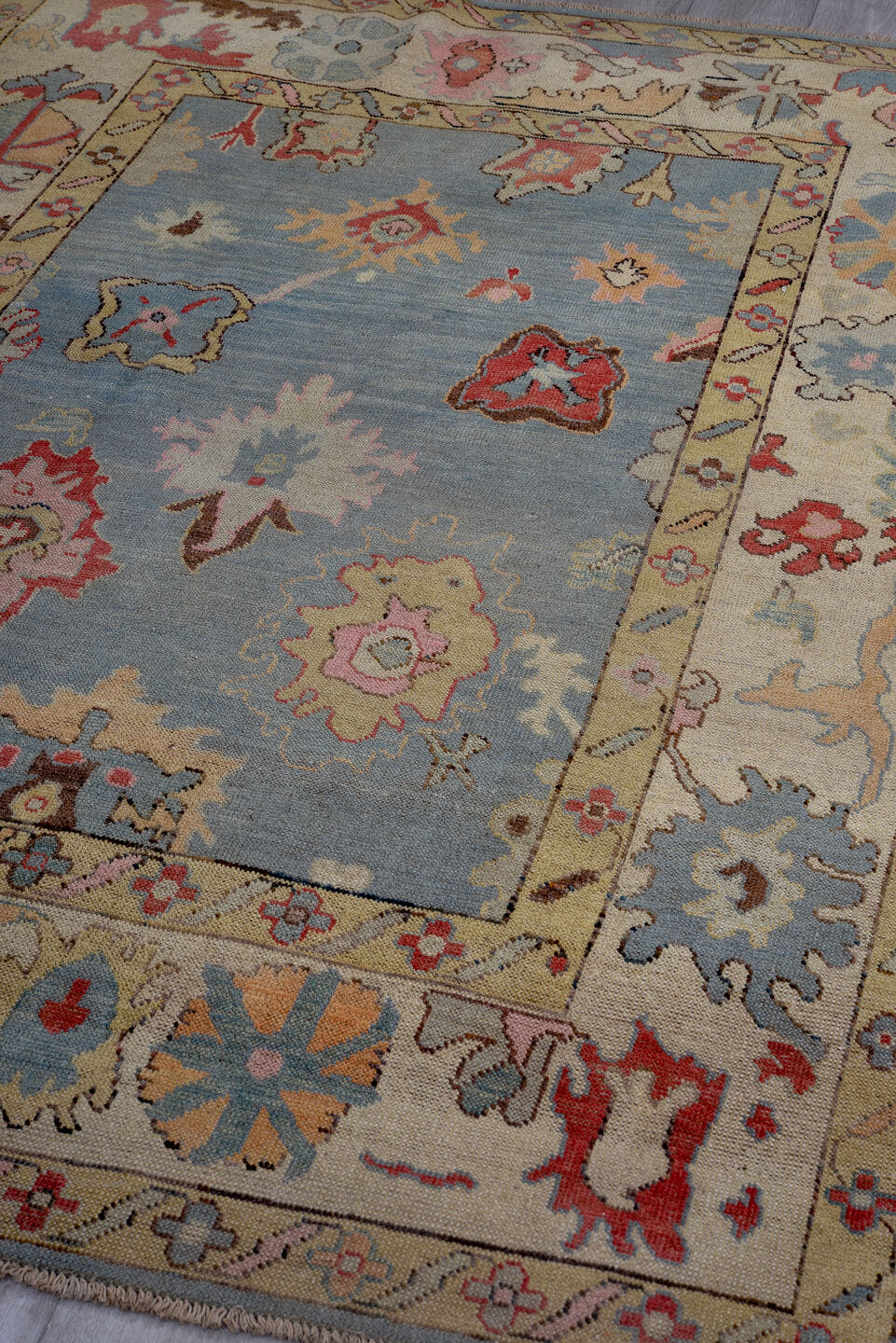 5' x 7' one-of-a-kind handmade vintage Oushak medium size rug. Color palette: blue, ivory, beige, pink, rust, sage, gold