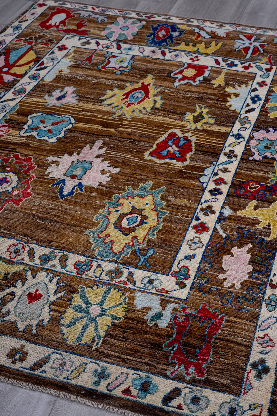 5' x 7' one-of-a-kind handmade vintage Afghan medium size rug. Color palette: brown, ivory, sky blue, crimson, gold, blush