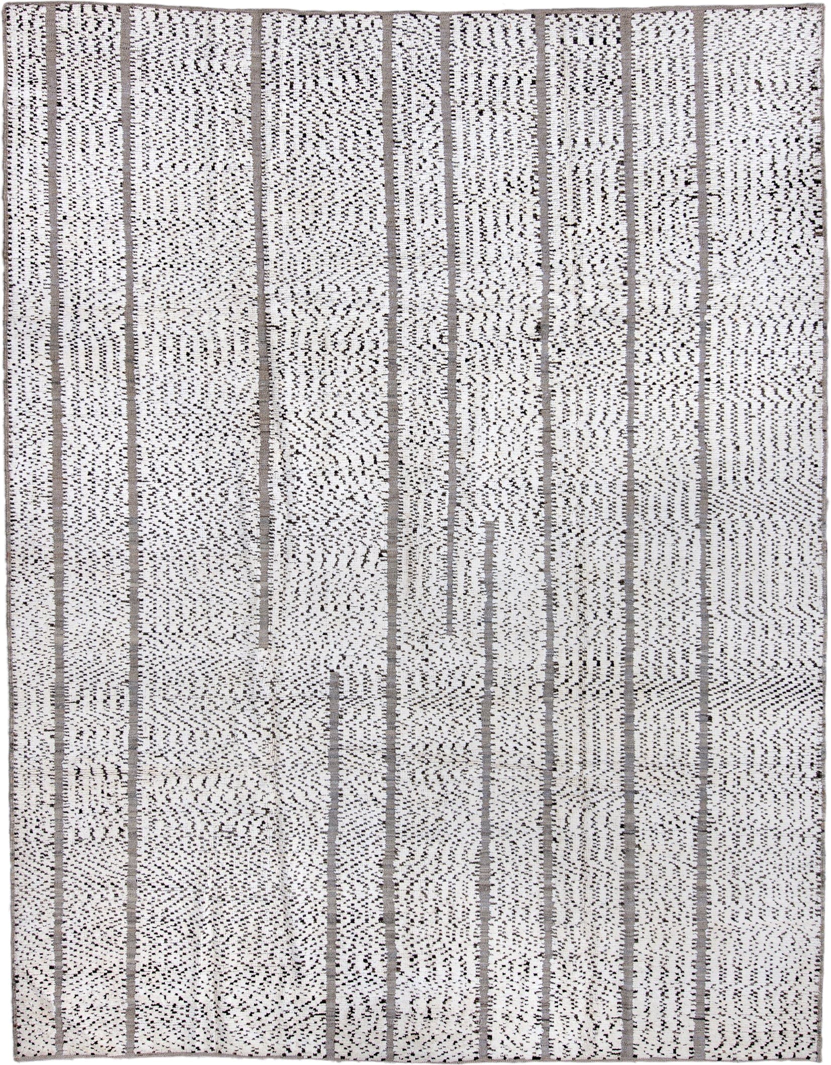 7' x 9' one-of-a-kind handmade vintage Tulu rug. Color palette: ivory, charcoal, taupe, gray, black, beige