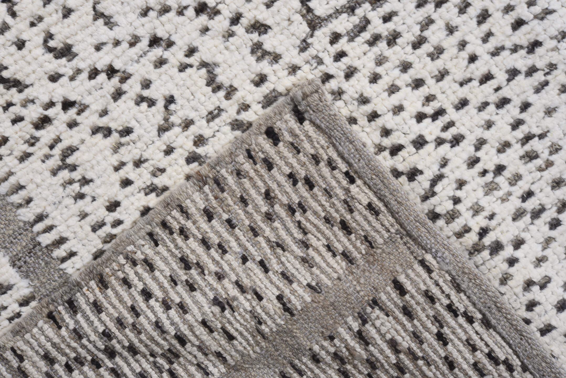 7' x 9' one-of-a-kind handmade vintage Tulu rug. Color palette: ivory, charcoal, taupe, gray, black, beige