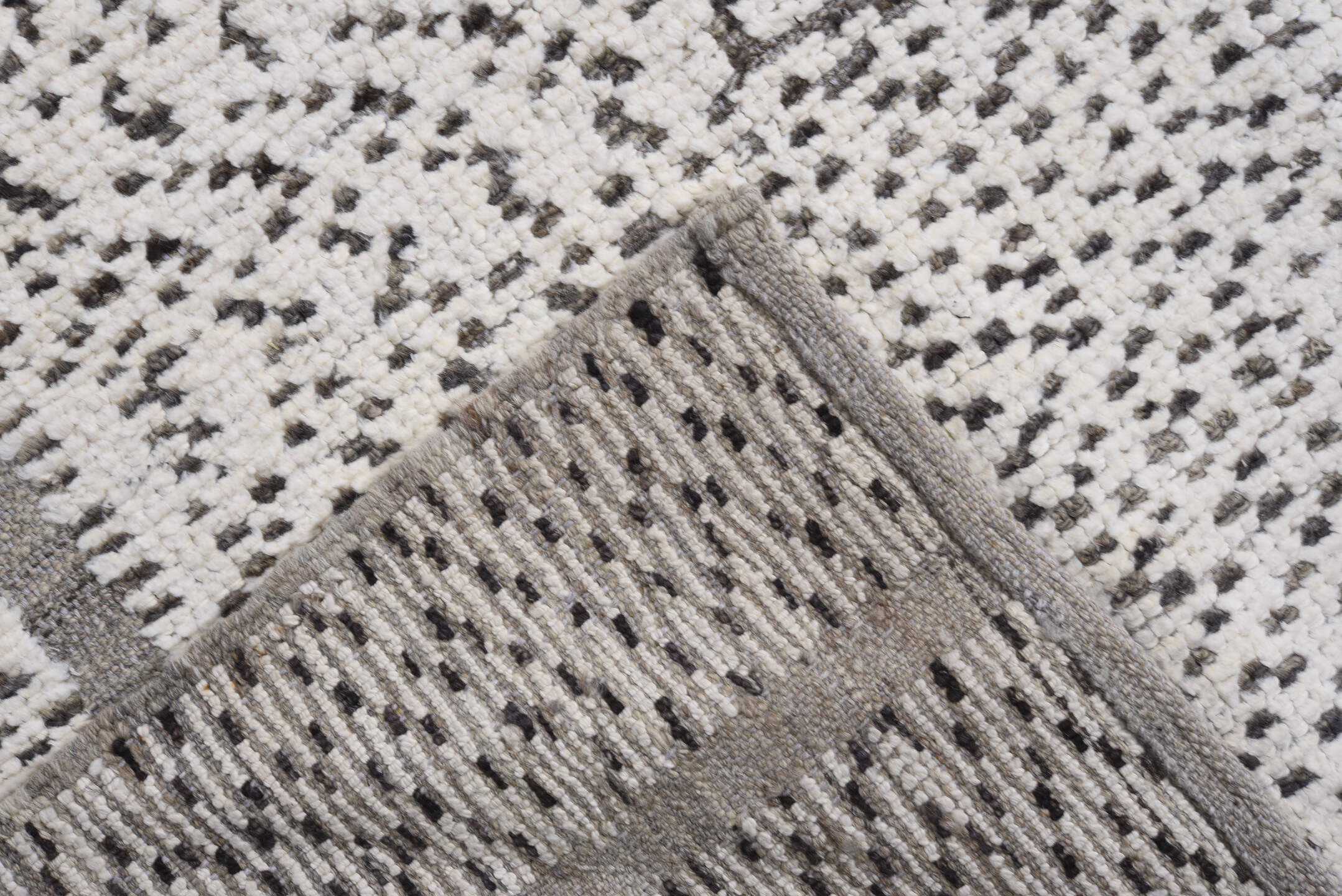 7' x 9' one-of-a-kind handmade vintage Tulu rug. Color palette: ivory, charcoal, taupe, gray, black, beige
