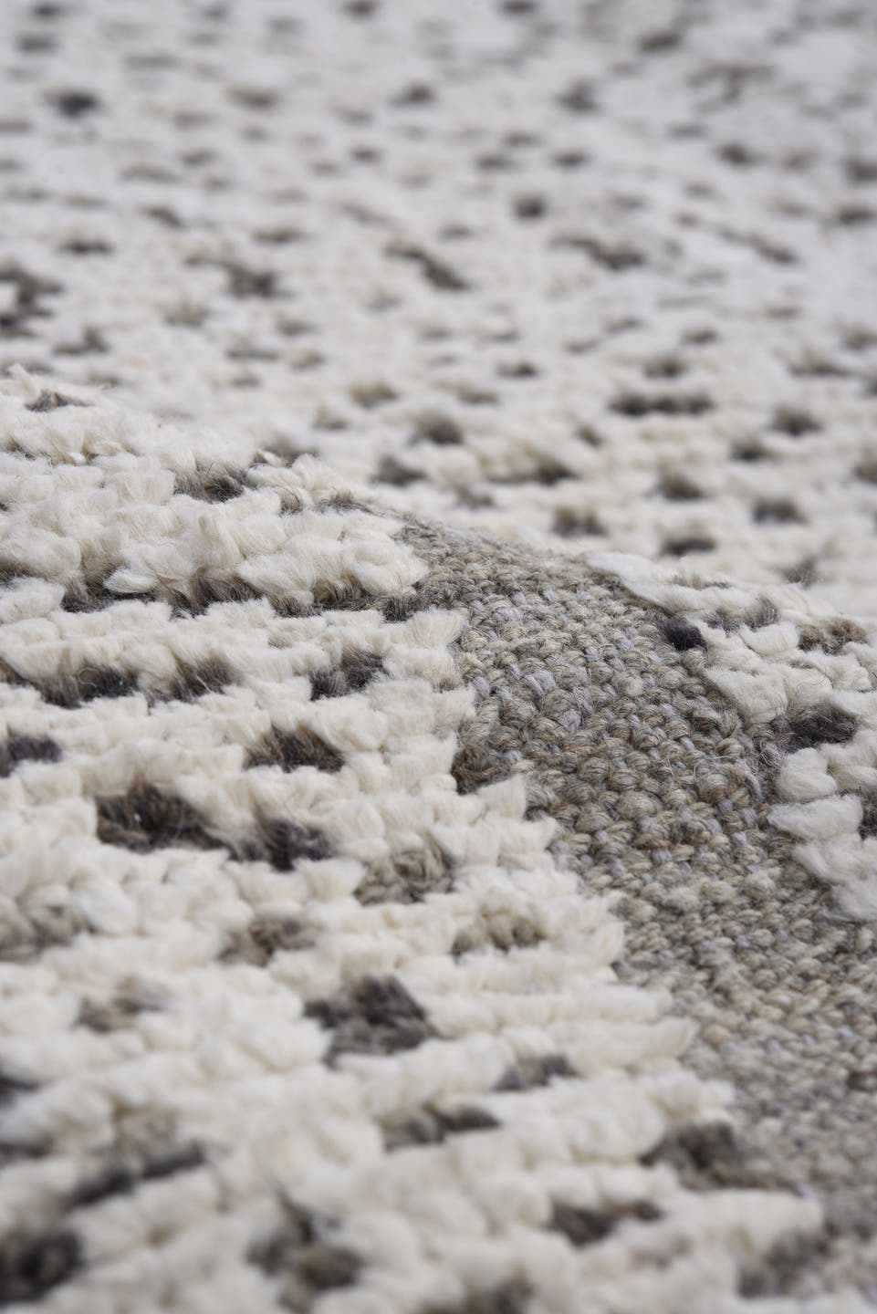 7' x 9' one-of-a-kind handmade vintage Tulu rug. Color palette: ivory, charcoal, taupe, gray, black, beige