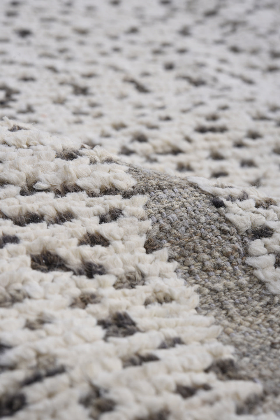 7' x 9' one-of-a-kind handmade vintage Tulu rug. Color palette: ivory, charcoal, taupe, gray, black, beige