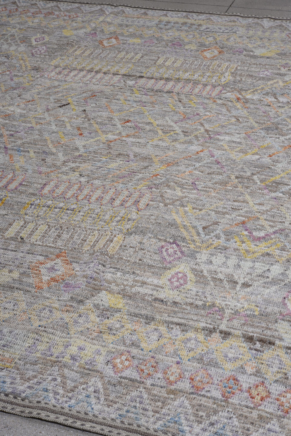 8' x 9' one-of-a-kind handmade vintage Tulu large size rug. Color palette: gray, ivory, taupe, lavender, saffron, rust