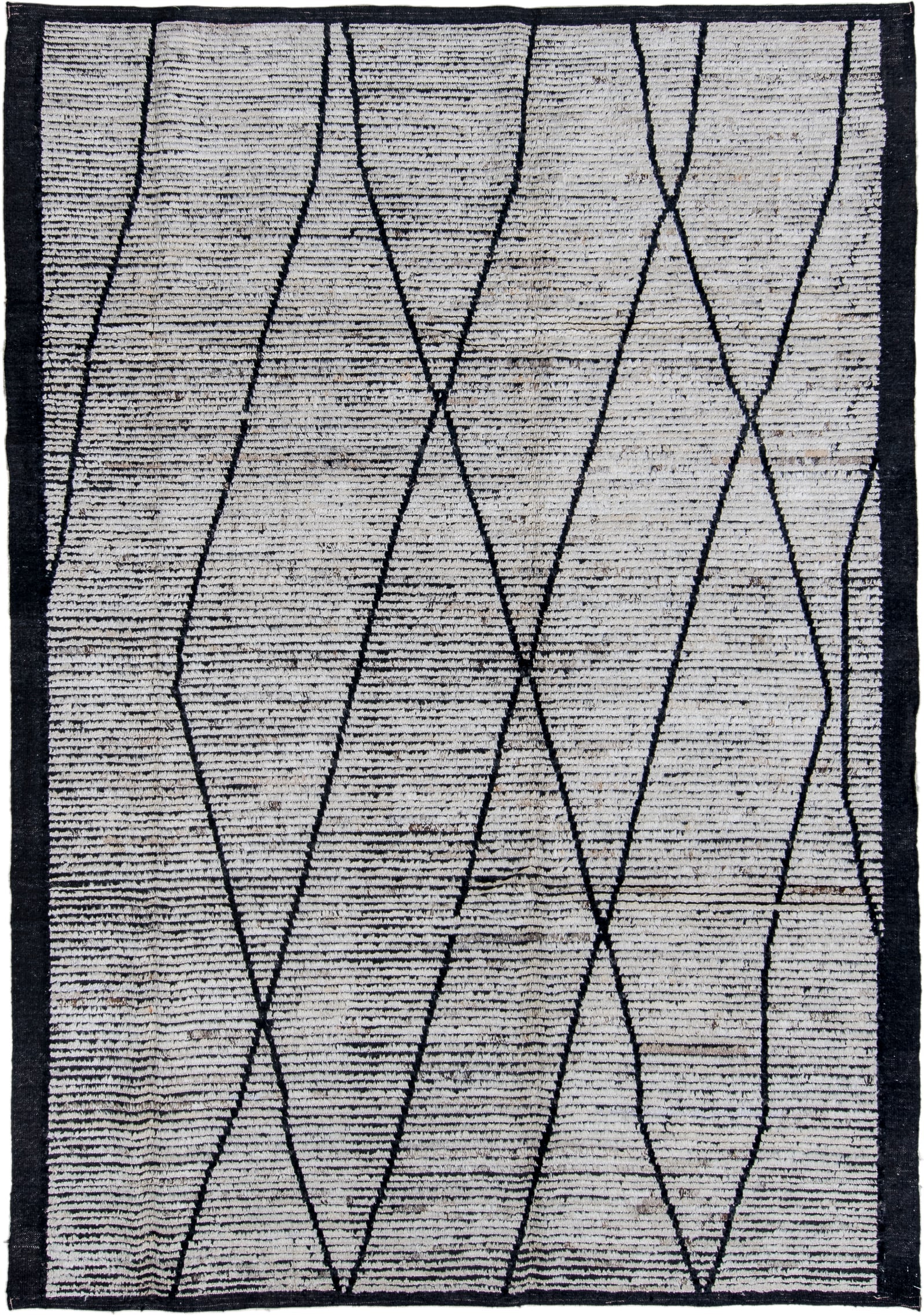 6' x 9' one-of-a-kind handmade vintage Tulu rug. Color palette: ivory, charcoal, black, gray