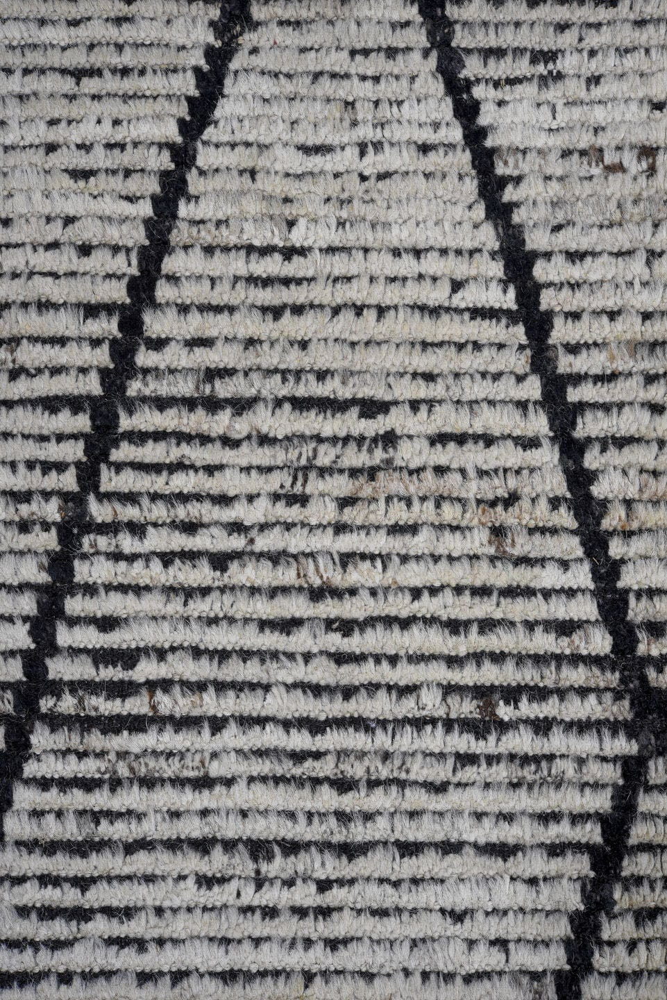 6' x 9' one-of-a-kind handmade vintage Tulu rug. Color palette: ivory, charcoal, black, gray