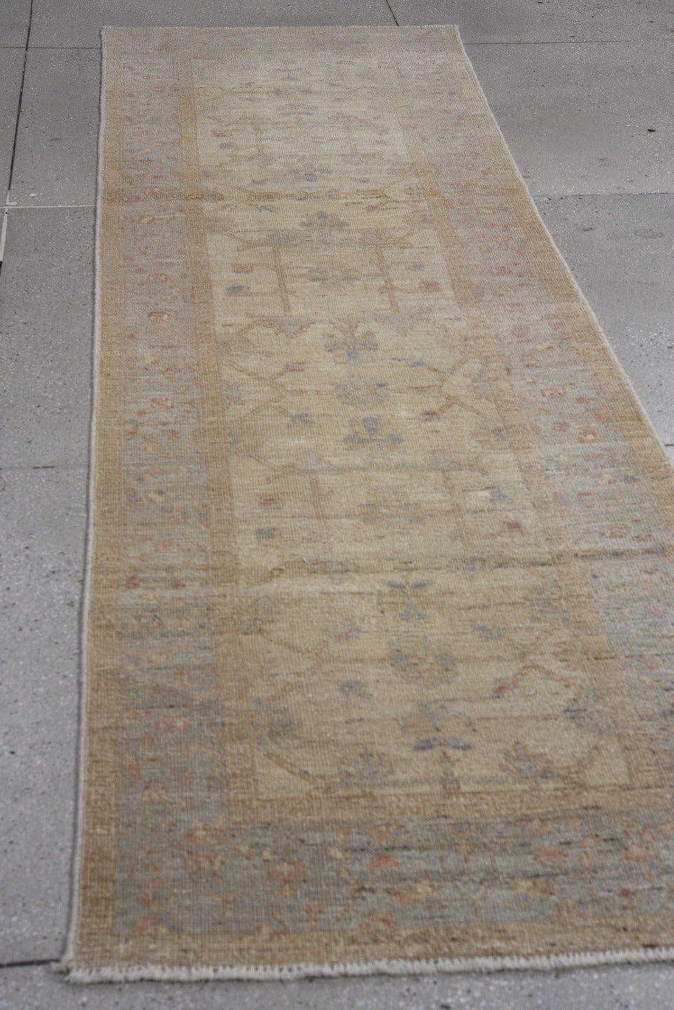 2' x 9' one-of-a-kind handmade vintage Oushak runner rug. Color palette: ivory, taupe, beige, pale blue, soft terracotta