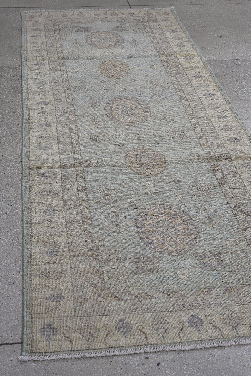 3' x 9' one-of-a-kind handmade vintage Oushak runner rug. Color palette: ivory, pale blue, taupe, lavender, beige, gray