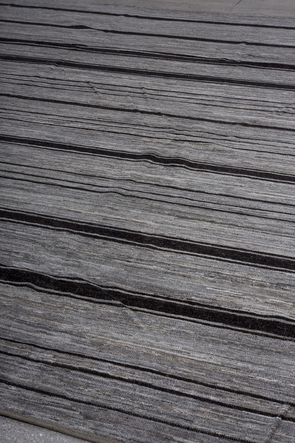 10' x 13' one-of-a-kind handmade vintage Tulu large size rug. Color palette: gray, charcoal, ivory, black