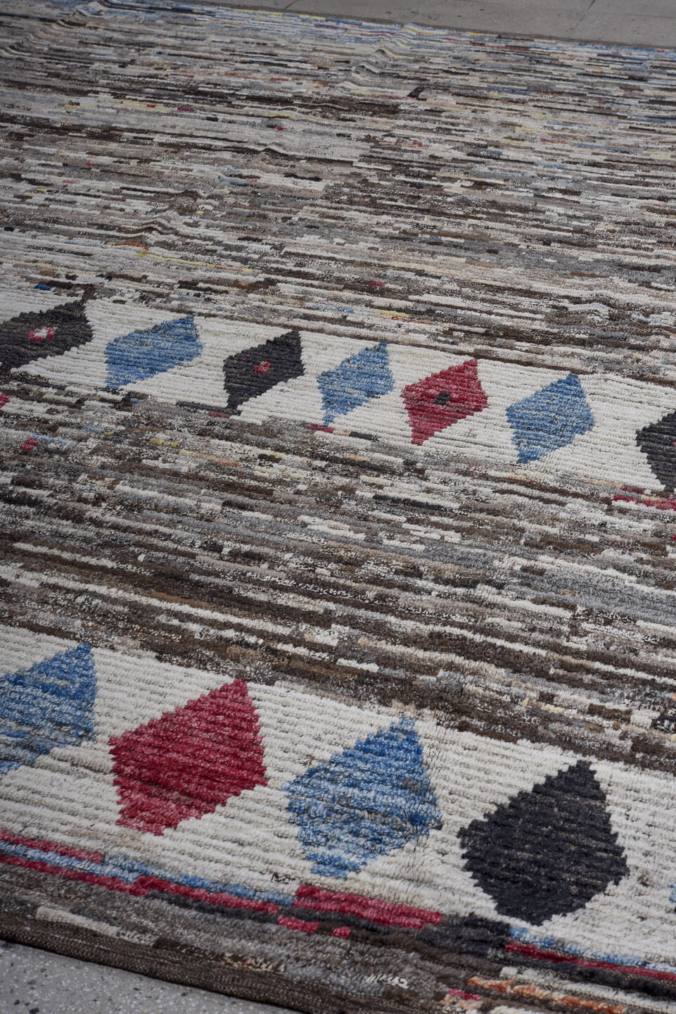 11' x 13' one-of-a-kind handmade vintage Tulu oversize rug. Color palette: brown, ivory, charcoal, sky blue, crimson, gray